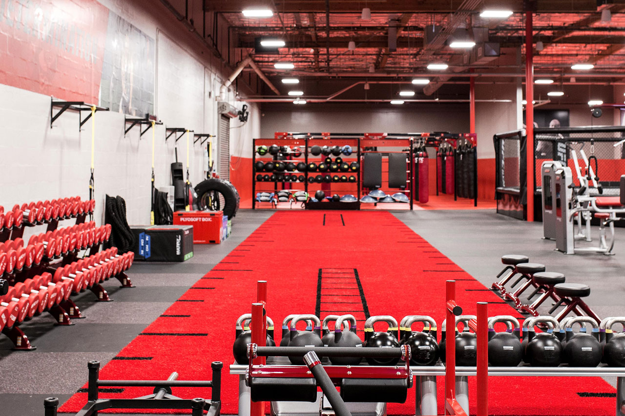 Inside shot of UFC GYM with equipment in the background