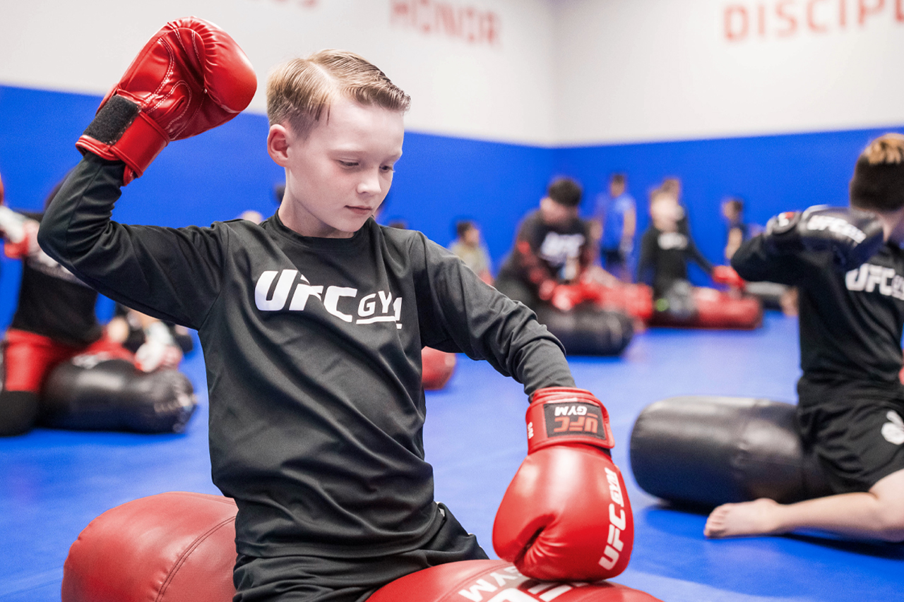 Young member punching a bag